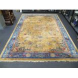 A Chinese beige and blue ground carpet,