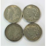 Two 'Morgan' 1 dollar pieces and two 'Peace' 1 dollar pieces,