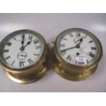 Two circular brass cased ship's type timepieces,
