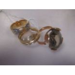 An 18ct gold two colour wedding ring, an 18ct gold snake ring and a stone set dress ring stamped '