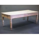 A pine farmhouse kitchen table with two end drawers, on turned legs 78 x 210 x 96cm