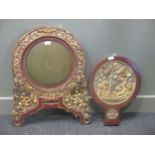 A Lacquer and gilt framed bronze mirror with stand