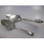 Two Victorian silver serving trowels, one with presentation engraving and filled handle, 10.5ozt