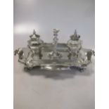 A Victorian silver desk inkstand, with two inkwells and a taperstick, 28.8ozt weighable silver