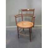A Godwinesque chair with caned seat