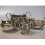 Two silver sugar bowls, a silver cream jug and a silver sauce boat, 35ozt gross (4)