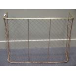 A nursery fire guard 69cm high and 92cm wide