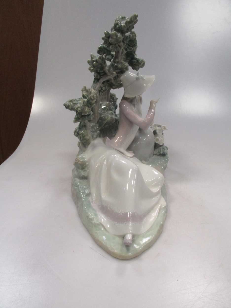 A Lladro figure of a lady reclining besides a tree - Image 7 of 7