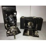 Two vintage folding Kodak cameras,