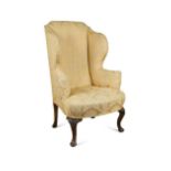 A Queen Anne style wing armchair, late 19th century,