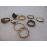 Four 9ct gold rings 8g gross, a ring marked '15ct', 5.4g, a ring marked '18ct', 1.7g and two 22ct