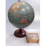 A model globe on stand, Santoni plated flute, wood carving of an old man, and few other small items