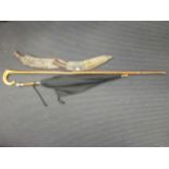 Two early 20th century crooks, an Edwardian umbrella, and a tall walking stick with moulded horn