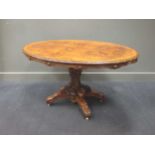 A Victorian walnut tilt-top loo table 70 x 130 x 92cm