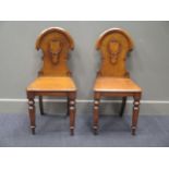 A pair of late Victorian oak hall chairs (2)