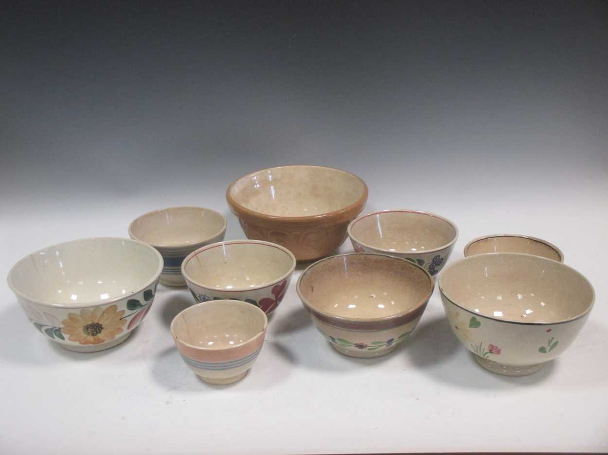 A quantity of stoneware pots and bottles and a group of English pudding bowls