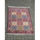 Five small modern patterned rugs, traditional designs mainly in wool on a red ground (5)