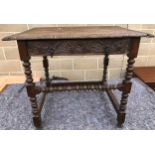 An 18th century oak and later carved side table with drawer, bobbin turned legs, 85cm wide