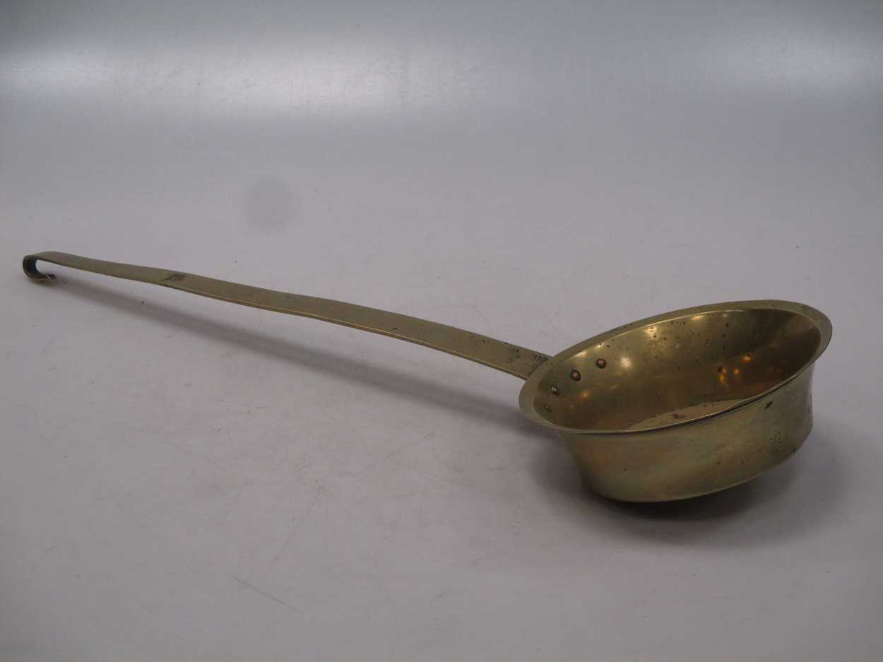 A 19th century brass ladle