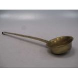 A 19th century brass ladle