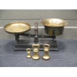 A large set of brass scales and weights