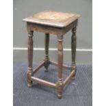 An 18th century oak stool, the square top over four turned legs with a peripheral stretcher 55 x