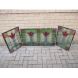 A triptych of 20th century stained glass panels largest 51.5 x 88cm