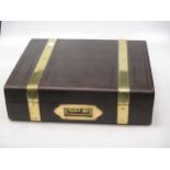 A leather and brass bound desk box with key