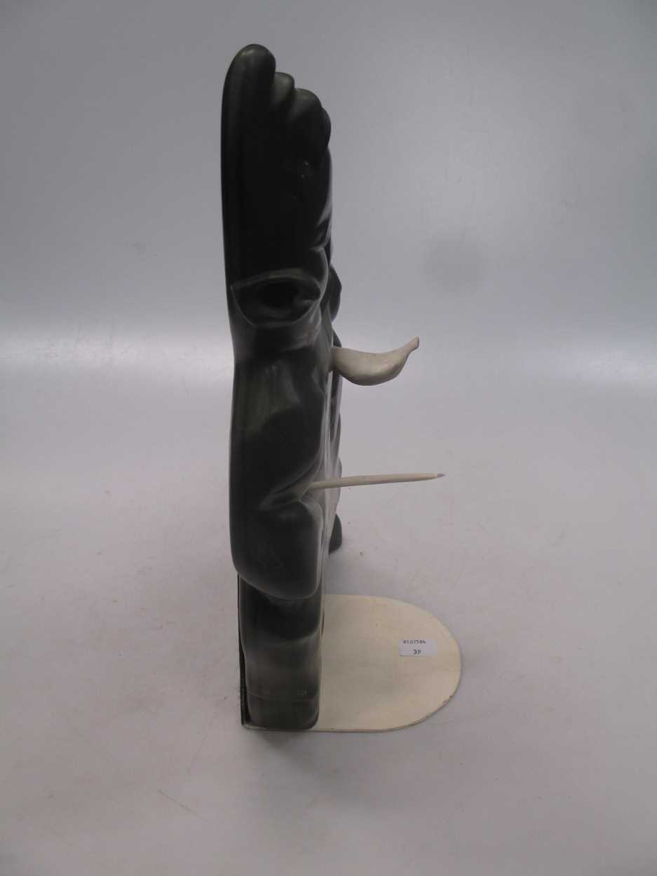 A 'Canada Eskimo Art' carved hardstone model of a hunter, with sticker to underside, on a stand, - Image 6 of 7