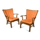 Fritz Hansen, a pair of stained beech lounge chairs,