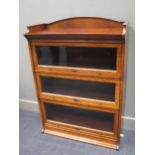A "LEBUS" oak three tier stacking bookcase with raised top on base 118 x 89 x 36cm
