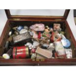 A small glazed top display case, early 20th century, with assorted miniature dolls' house