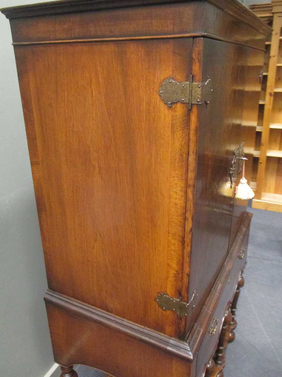 An 18th century style crossbanded walnut cabinet on stand, the two doors over a single long drawer - Image 5 of 9