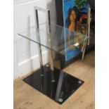 After Eileen Gray, a chrome and glass occasional table,