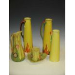 Various early 20th century pottery yellow ground jugs to include Carlton Ware (6)