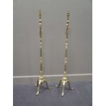 A pair of brass standard lamps approx 140cm high