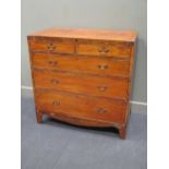 An early 19th century mahogany chest of drawers, with two short over three long graduating drawers