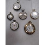 An open faced pocket watch marked '18' together with an unusual gold plated dress pocket watch and
