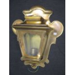 A brass cased wall light