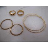 Two rings and two pairs of hoop earrings, all unhallmarked but testing to at least 18ct quality 18.