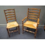 A set of ten reproduction ladder back chairs with rush seats, two elbow, eight standard.