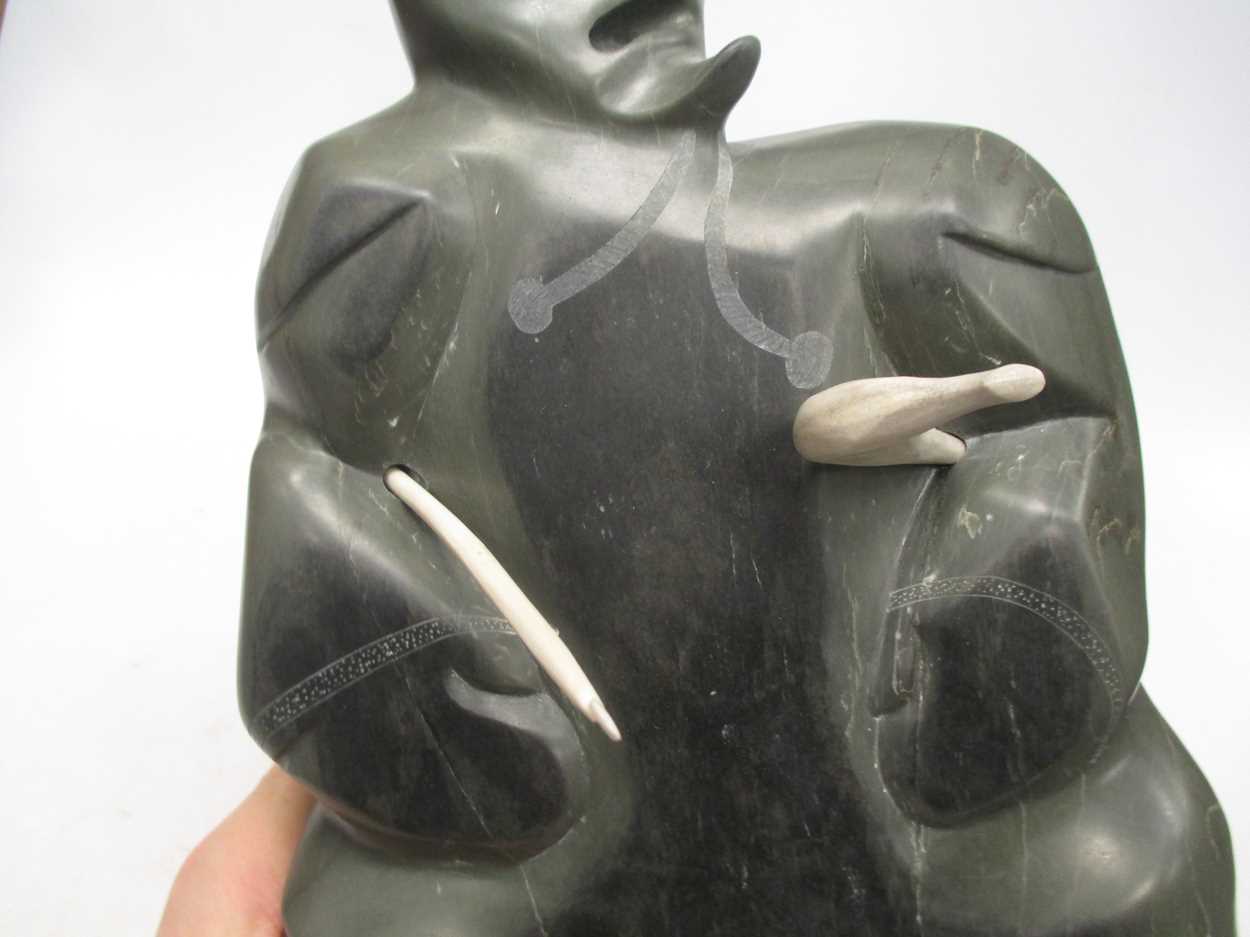 A 'Canada Eskimo Art' carved hardstone model of a hunter, with sticker to underside, on a stand, - Image 5 of 7