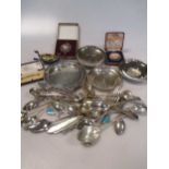 A collection of silver flatware, 4 silver dishes, two silver medals and a Norwegian silver and