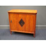 A Continental side cabinet, the door with a lozenge shaped inlaid panel depicting a deer, 84 x 90