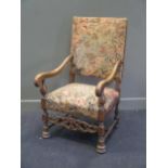 A mahogany framed needlepoint upholstered armchair