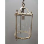 A brass cylindrical hall lantern