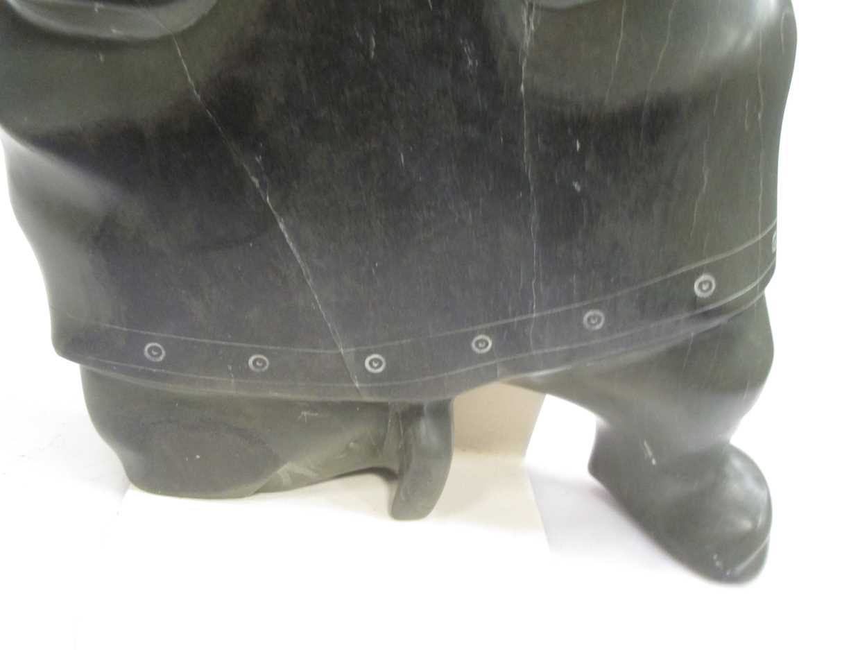 A 'Canada Eskimo Art' carved hardstone model of a hunter, with sticker to underside, on a stand, - Image 2 of 7
