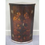 A George III chinoiserie painted oak two door corner cupboard, with key, 92cm high and 56cm wide