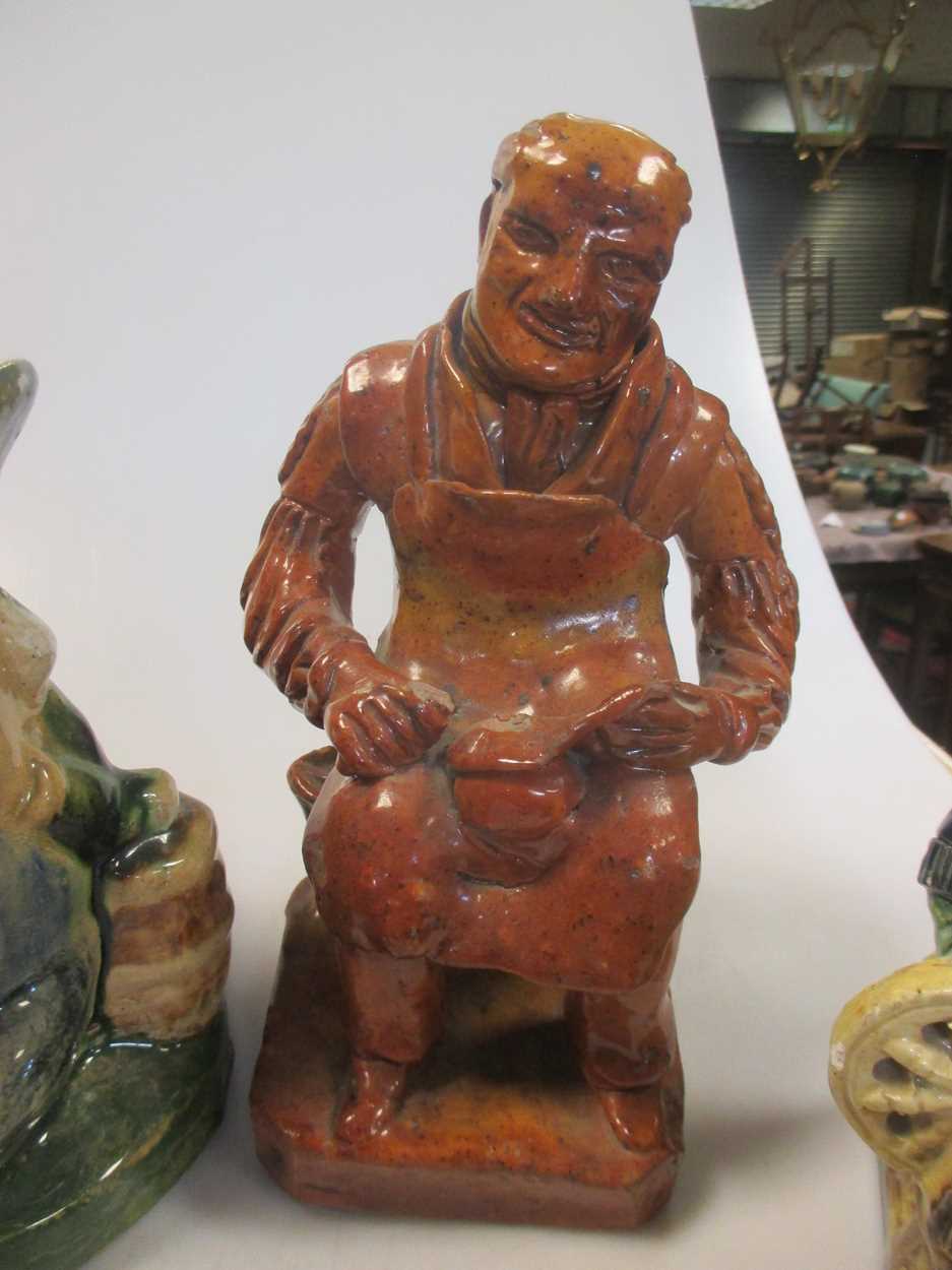 Three glazed pottery seated figures, a Toby jug, another jug, and a pair of glazed money boxes, 19th - Image 3 of 5