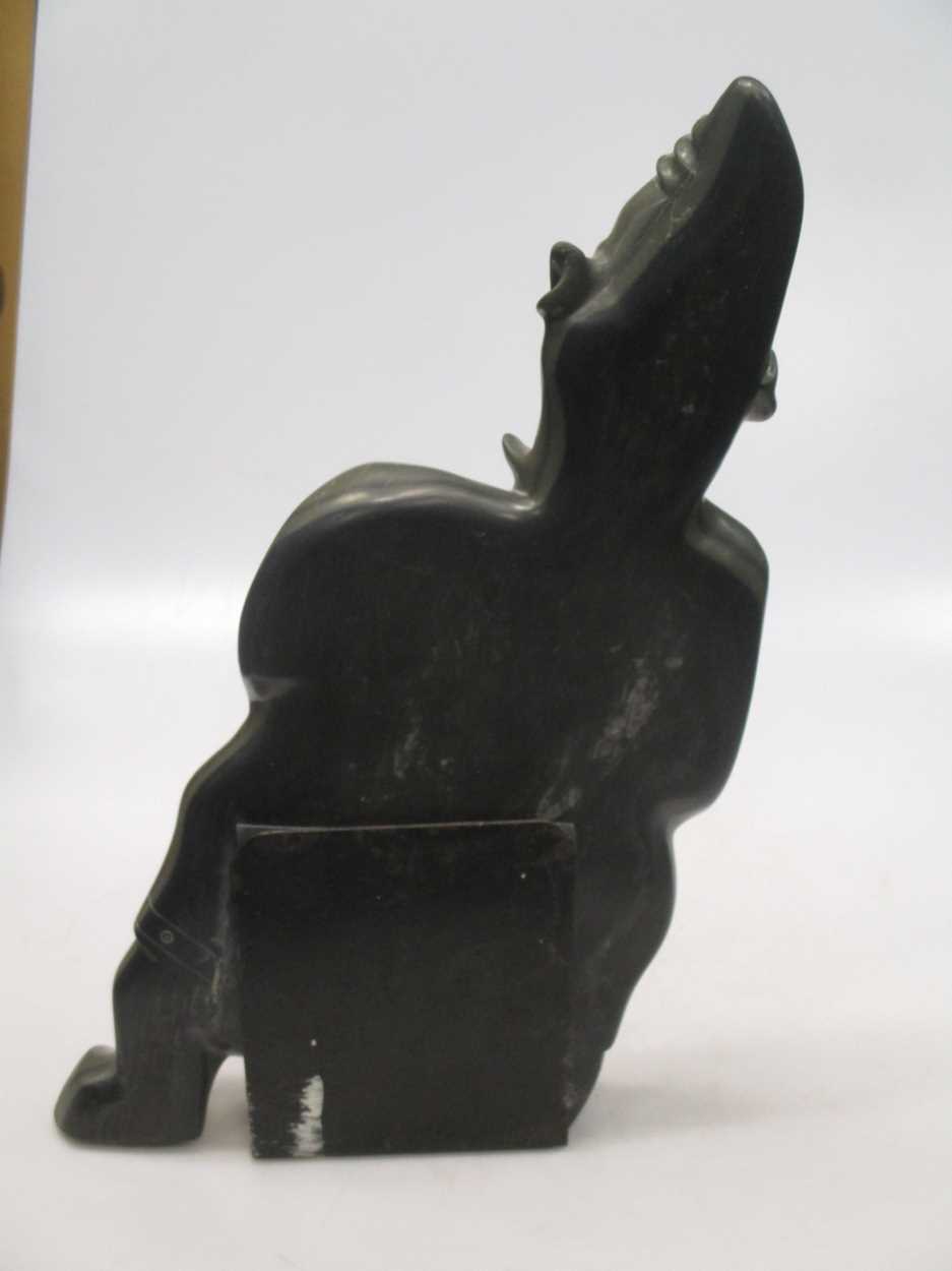 A 'Canada Eskimo Art' carved hardstone model of a hunter, with sticker to underside, on a stand, - Image 7 of 7